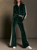 Tummanvihreä sametti vetoketjullinen takki ja sivuraita levenevät housut